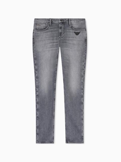 EMPORIO ARMANI J06 SLIM-FIT WASHED DENIM JEANS WITH EAGLE EMBROIDERY