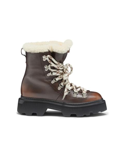 Women's brown leather hiking boot with fur