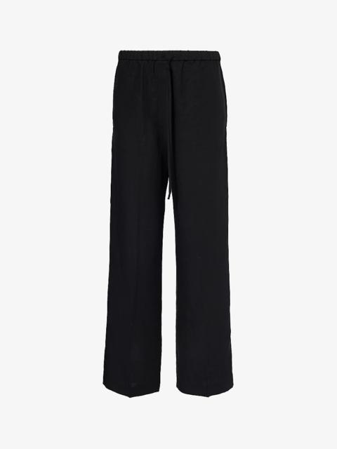 Totême Wide-leg relaxed-fit woven trousers