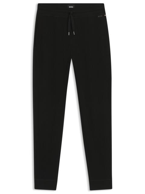 BOSS WAFFLE-STRUCTURE TRACKSUIT BOTTOMS IN A COTTON BLEND