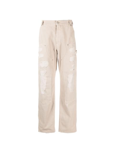 Destroyed canvas ripped carpenter trousers