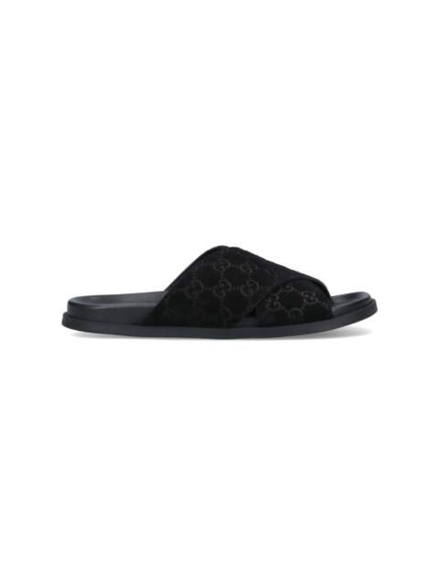 GUCCI Leather slides with all-over GG motif