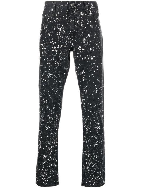 Diag-stripe paint-splatter skinny jeans