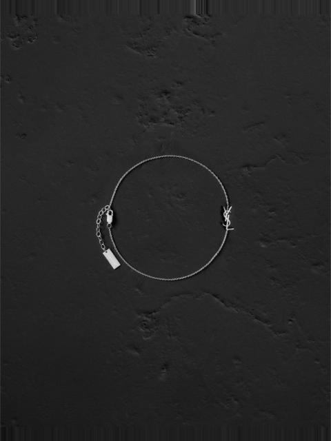 SAINT LAURENT CASSANDRE ANKLE BRACELET IN 18K GREY GOLD