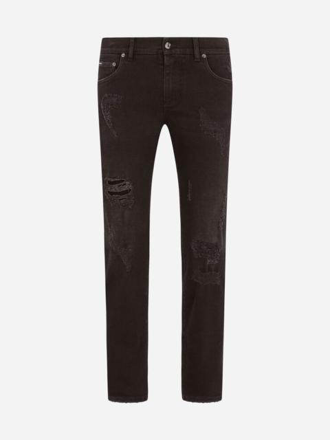 Black skinny stretch jeans with repaired rips