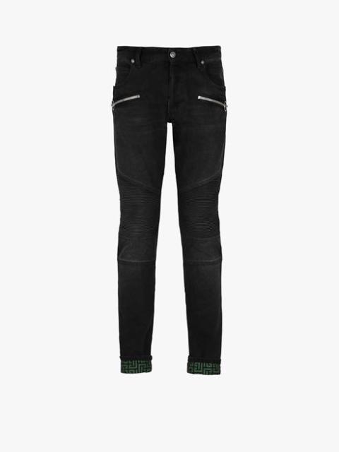 Slim cut faded and ridged black cotton jeans with Balmain monogram on hem