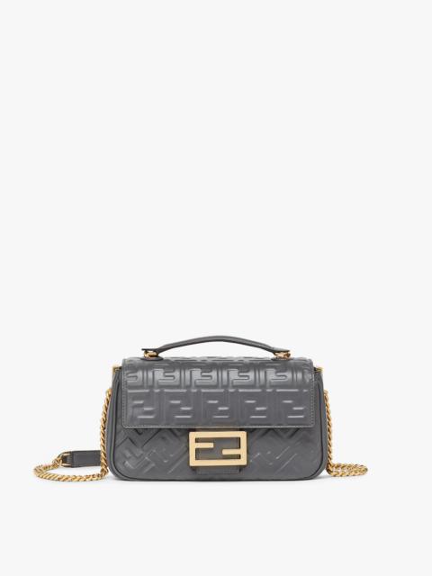 FENDI Iconic medium Baguette bag with chain, made of dark gray soft nappa leather with a 3D texture FF mot