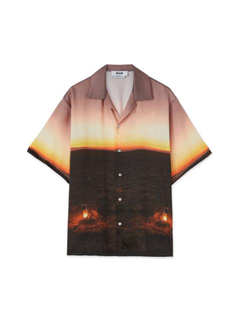Fluid fabric  bowling shirt with "Tanzanian gaze torch snap" print