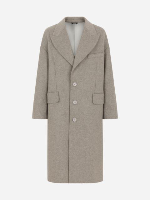 Deconstructed single-breasted wool coat