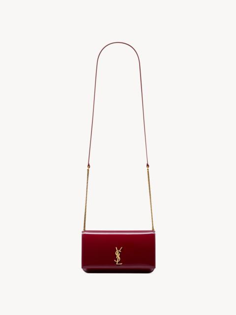 SAINT LAURENT CASSANDRE PHONE HOLDER IN PATENT LEATHER