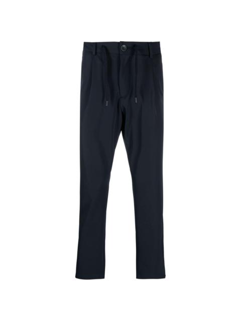 Herno logo-plaque button-fastening tapered trousers