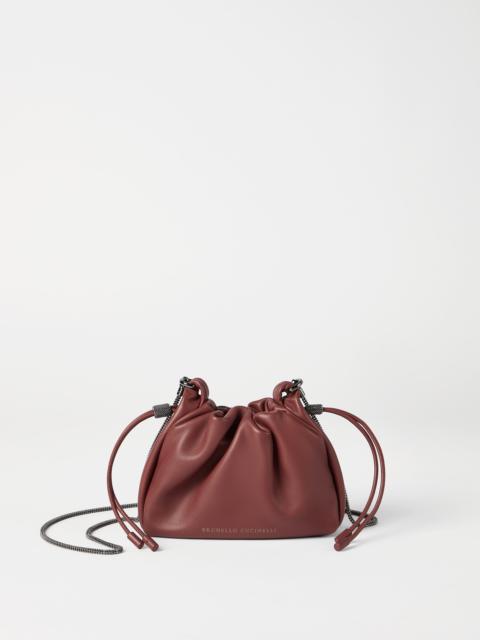 Brunello Cucinelli Mellow mini bucket bag in soft leather with precious chain