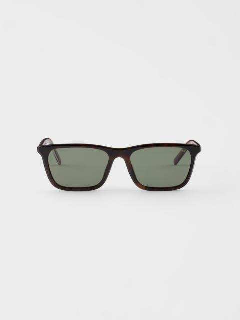 Prada Prada sunglasses with the iconic metal plaque