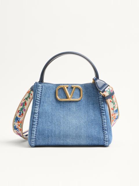 Valentino VALENTINO GARAVANI ALLTIME MEDIUM HANDBAG IN DENIM WITH EMBROIDERED STRAP