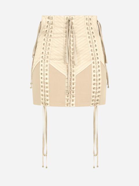 Jersey miniskirt with laces and eyelets
