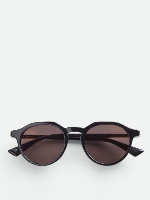 Bottega Veneta® Cangi Wraparound Injected Acetate Sunglasses in Yellow /  Bronze. Shop online now.