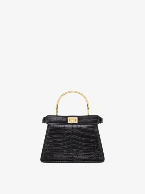 FENDI Iconic Peekaboo ISeeU bag in an ideal, compact size. Made of exquisite black crocodile leather and e