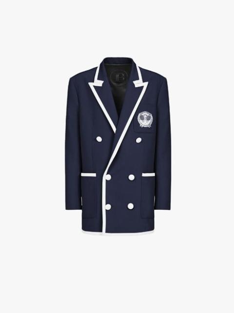 Navy blue wool blazer with embroidered Balmain logo and double-breasted white buttoned fastening