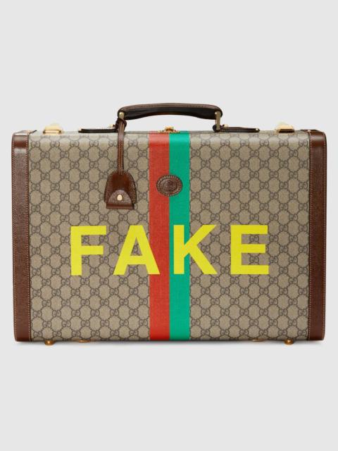 GUCCI 'Fake/Not' print medium suitcase