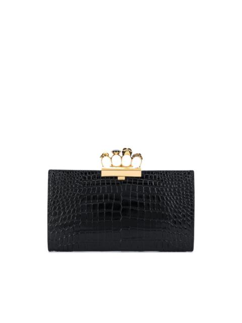 Four Ring embossed clutch bag