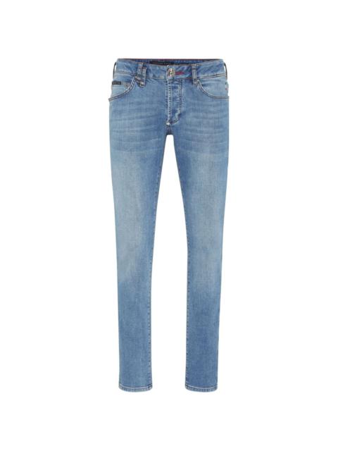 low-rise slim-fit tapered jeans