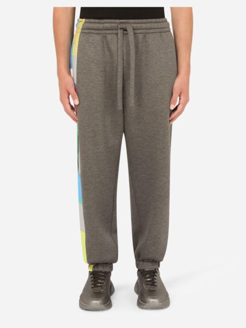 Technical jersey jogging pants with printed band