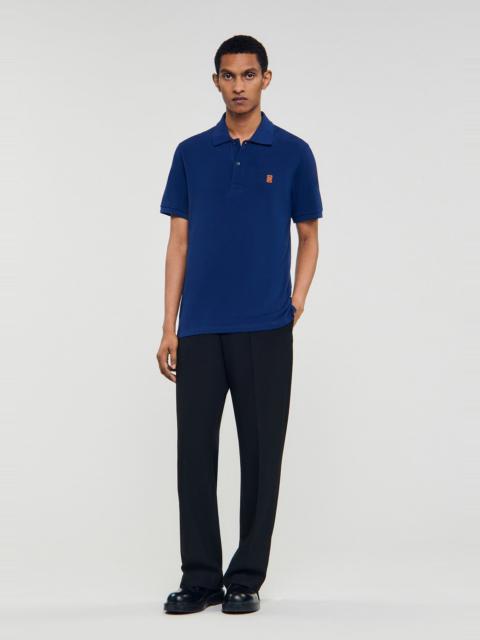 Sandro POLO SHIRT WITH LEATHER LOGO