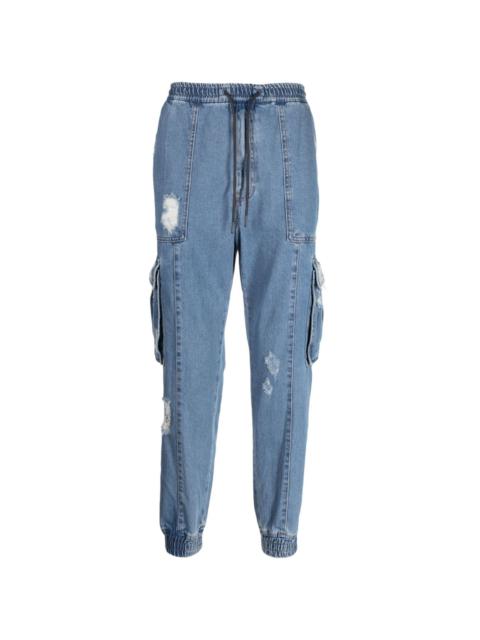 distressed-effect drawstring cotton tapered jeans