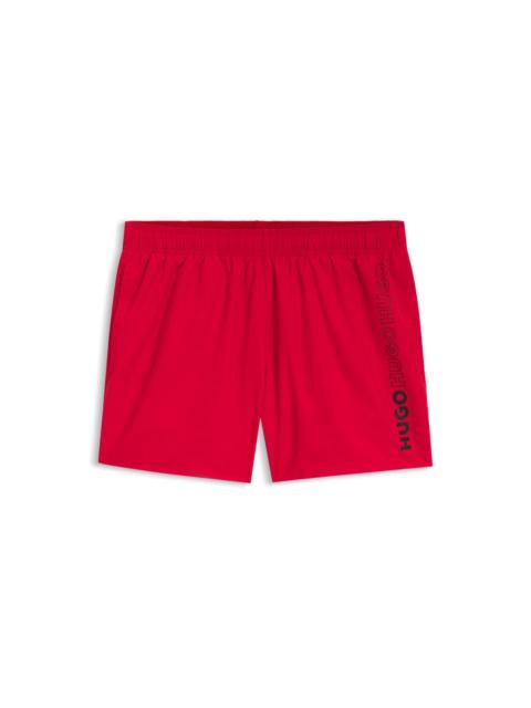 HUGO SWIM SHORTS WITH REPEATED LOGOS