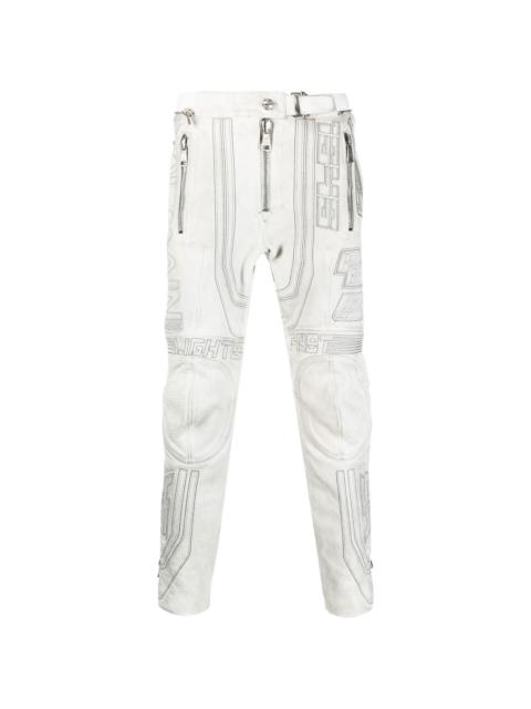 embroidered-design tapered leather trousers