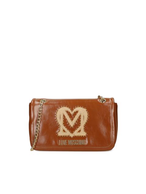 Moschino logo-plaque studded shoulder bag