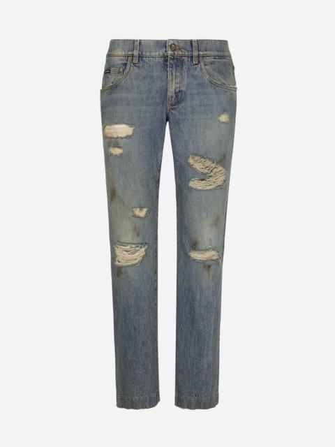Washed denim jeans with rips