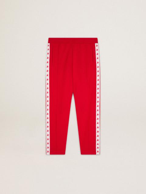 Women's red joggers with stars on the sides