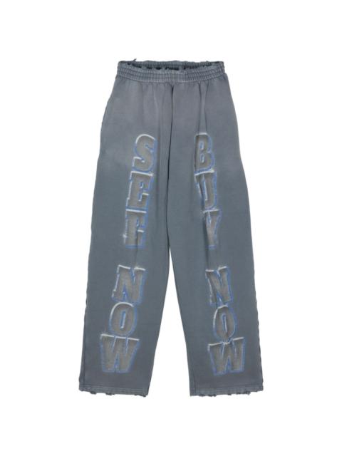 BALENCIAGA slogan-print cotton track pants