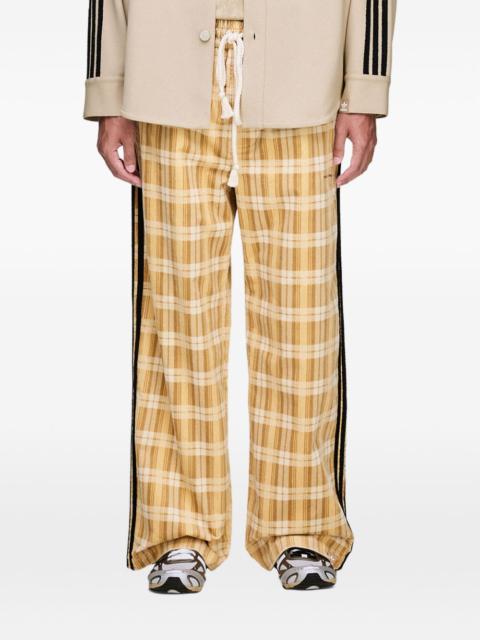 Song for the Mute x Adidas logo check trousers
