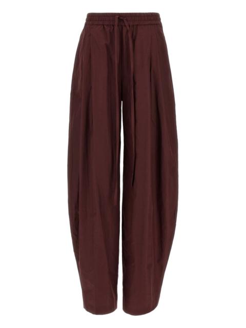 THE ANDAMANE pleated tapered trousers