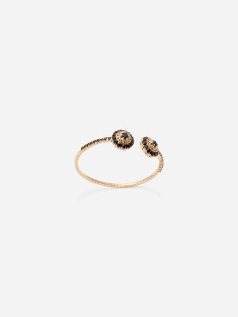 Family yellow gold bracelet with rosette motif and black sapphire