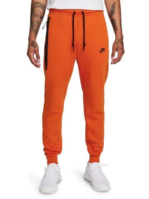 M NK TCH FLC JGGR in Campfire Orange/Black