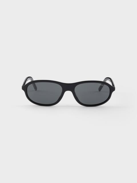 Prada Prada sunglasses with the iconic metal plaque