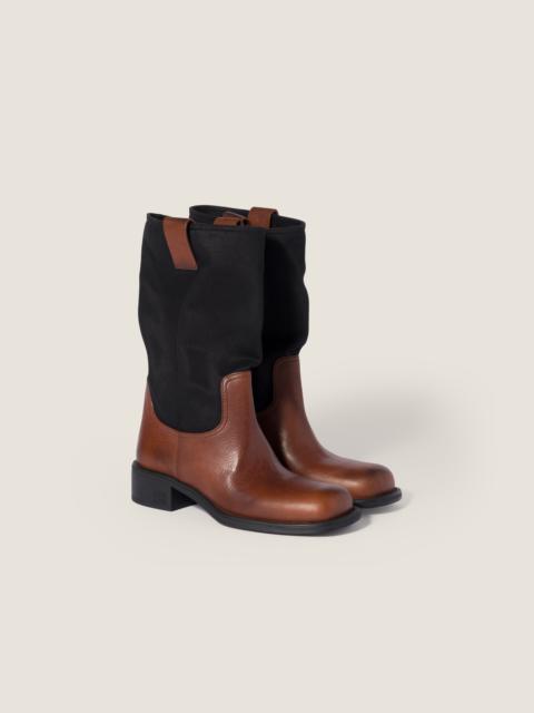 Miu Miu Leather and drill mid-calf boots