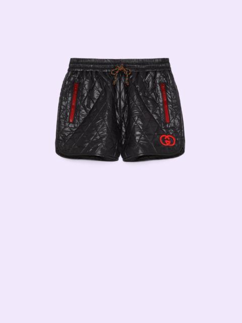 GUCCI Quilted nylon shorts with patch