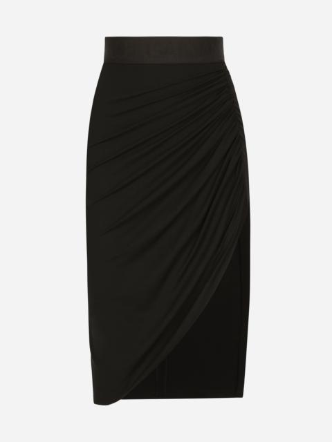 Asymmetrical jersey skirt with draping