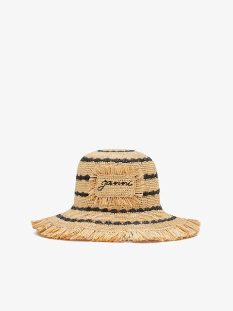 GANNI BUCKET HAT IN STRIPED RAFFIA