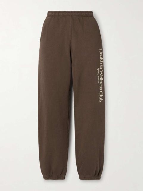Sporty & Rich Printed cotton-jersey track pants Chocolate