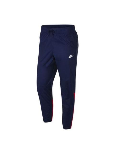 Nike 남자 나이키 로고 자수 대조 색깔에 의하여 길쌈된 뭉치 발 스포츠 바지/Trousers/Joggers 파란