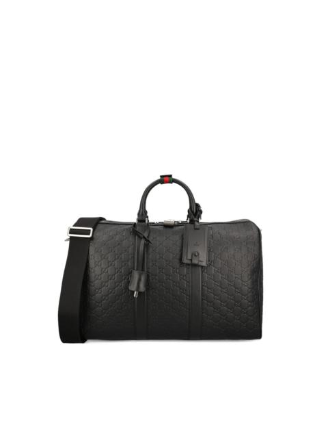 GUCCI medium GG Emblem embossed holdall