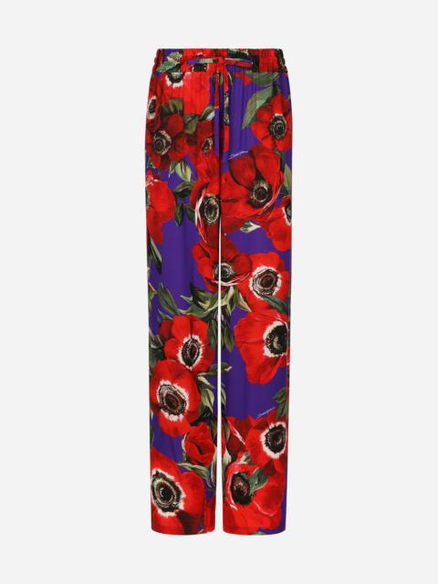 Dolce & Gabbana Flared charmeuse pants with anemone print