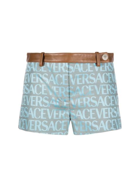 VERSACE Allover logo-jacquard belted shorts