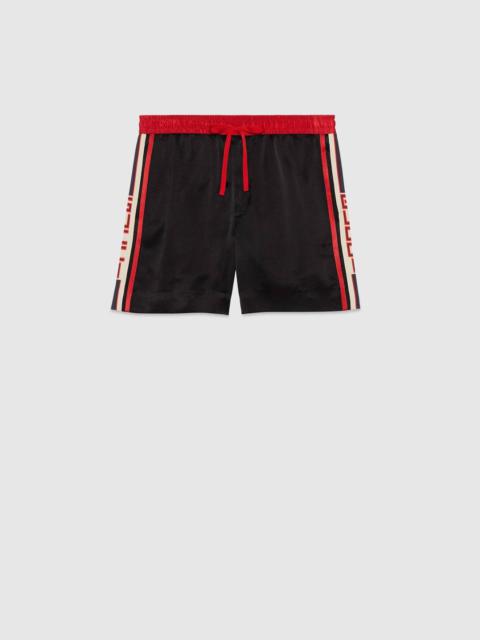 GUCCI Acetate shorts with Gucci stripe