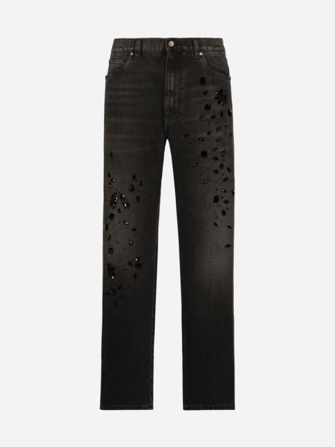 Oversize washed jeans with rhinestone embellishment